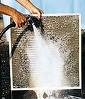 Washing electrostatic furnace filter with a hose